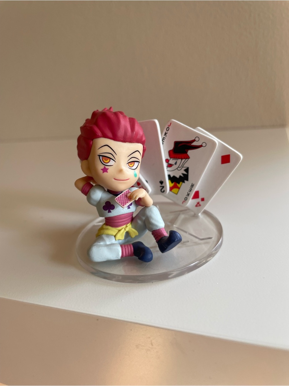Anime Card Trick Figure with Red Hair and Playing Cards